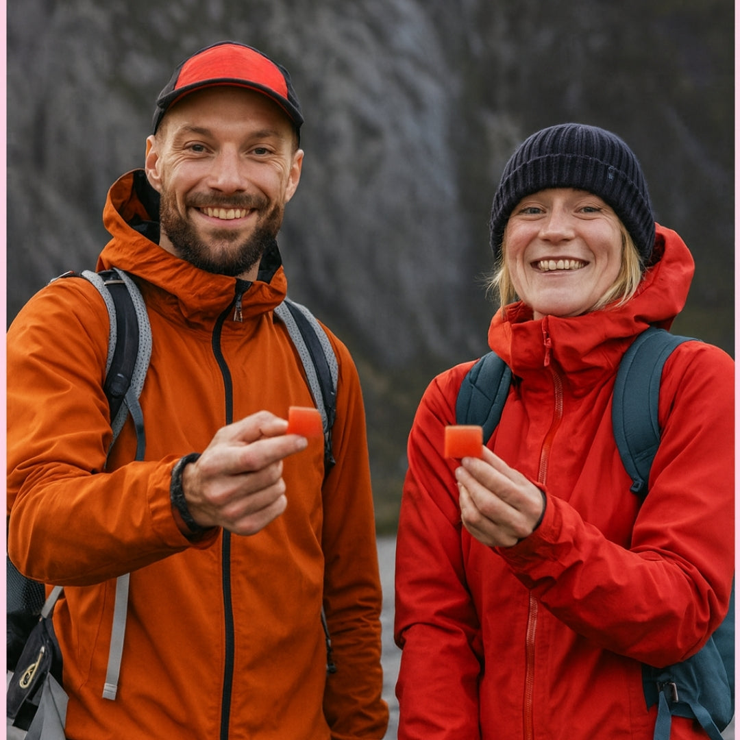 Hikers holding THRIVE+ strawberry creatine gummies outdoors